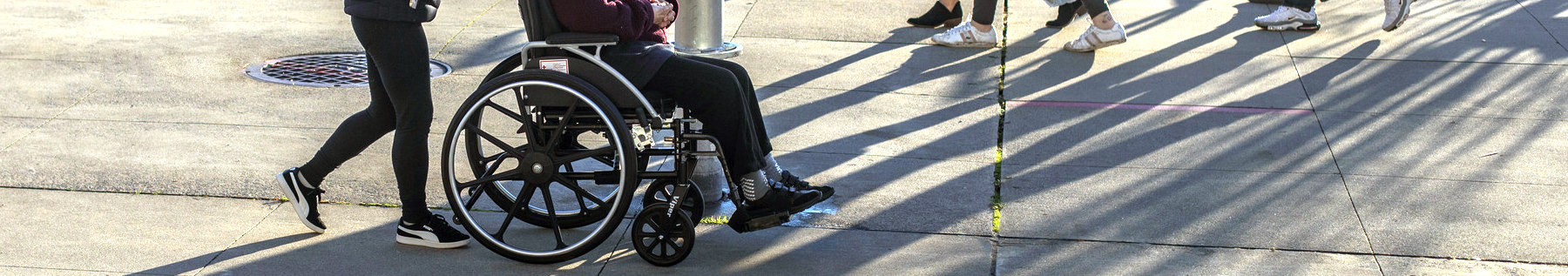 pedestrian and person in wheelchair