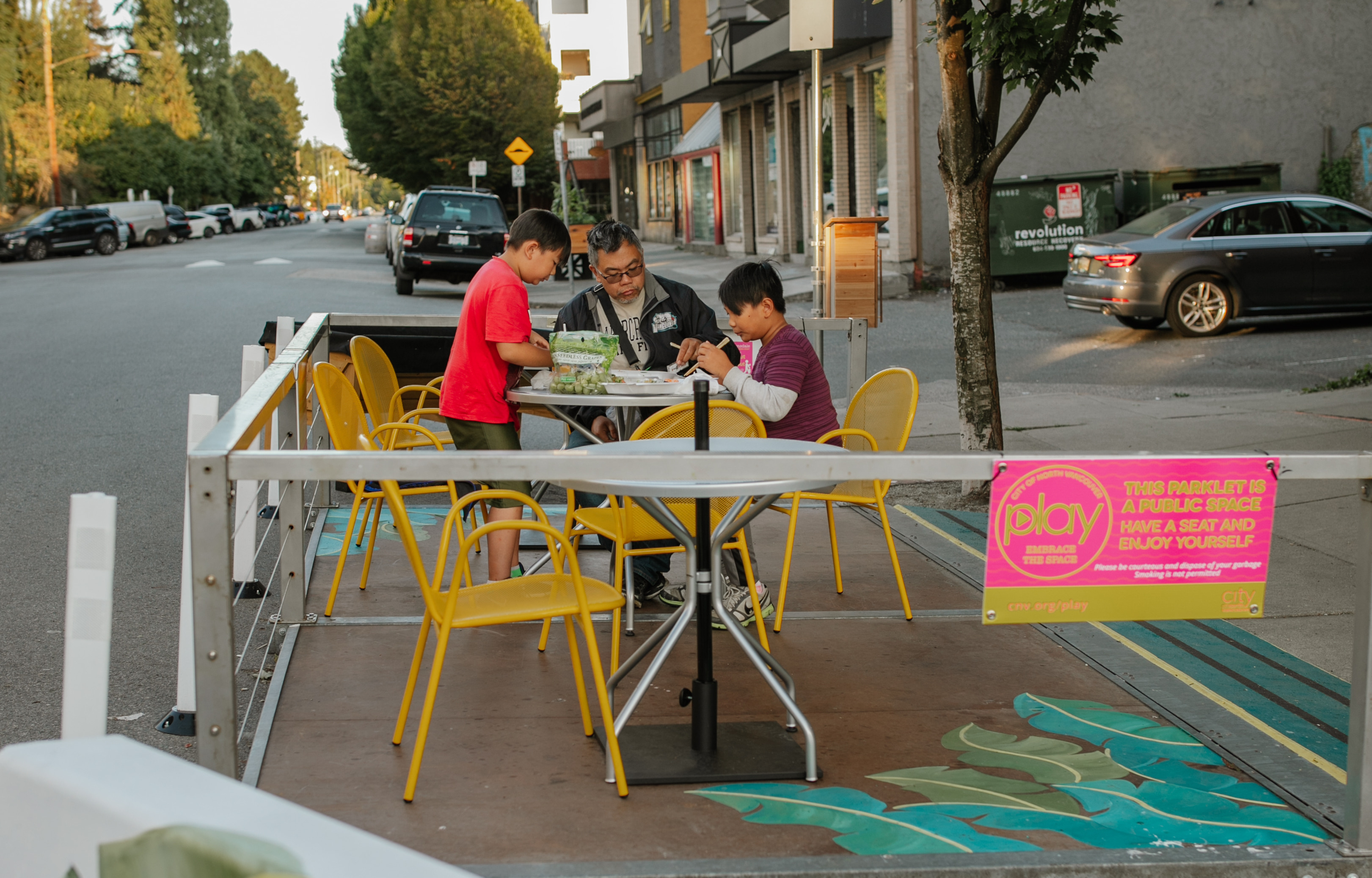 family eating at a parklet