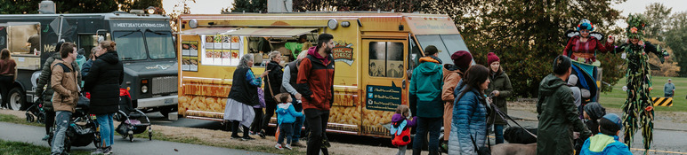 Food trucks and event stilt walkers