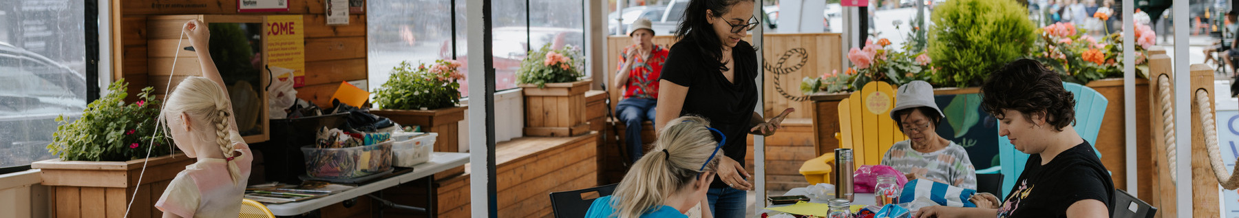 People crafting in a parklet