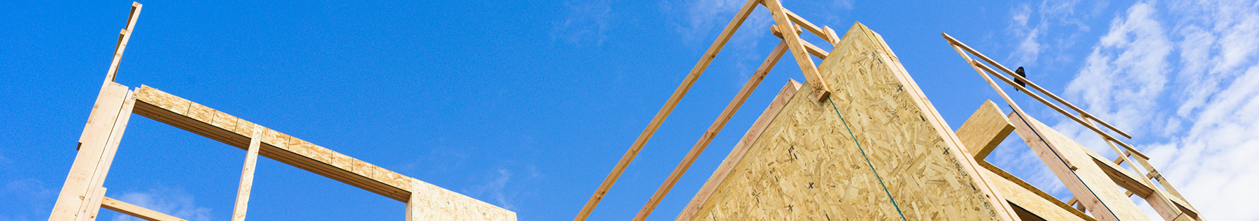 wood construction against blue sky