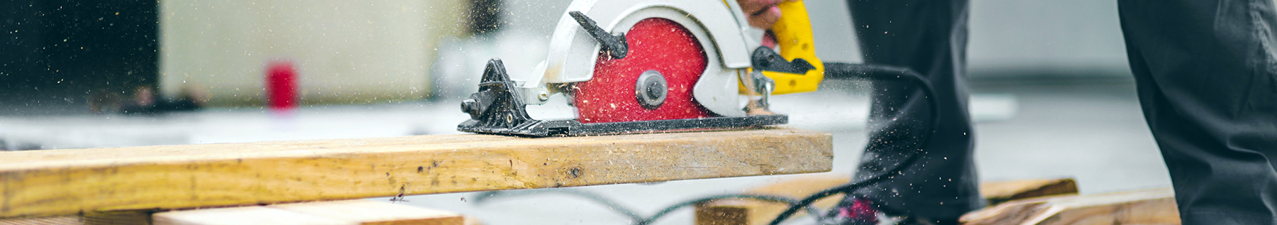 cutting wood with saw