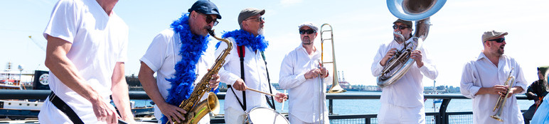 Six piece brass band busking at The Shipyards.