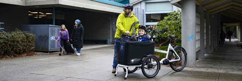 ecargo bike with father and son