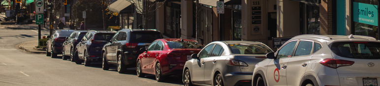 Vehicles parked at curb.