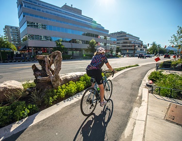 person riding bike in bike lane