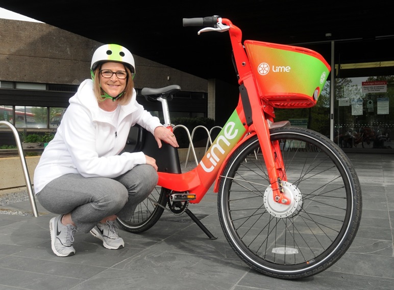 City of North Vancouver Mayor, Linda Buchanan poses with a Lime bike